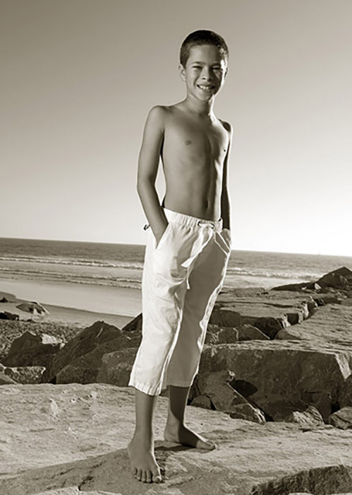 Boy at beach bw